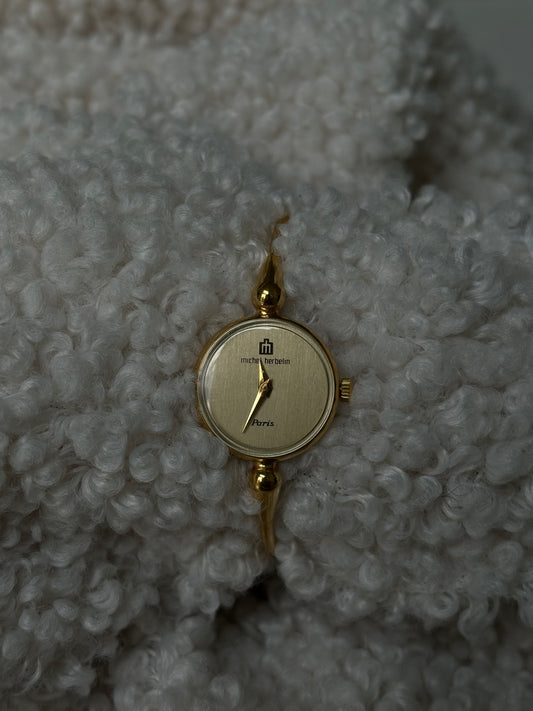 Gold thin bracelet-style watch